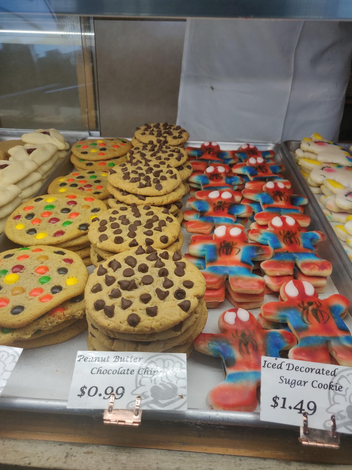 Decorated cookies including peanut butter chocolate chip and iced sugar cookies